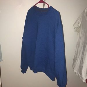 Medium tone blue crew neck that is a size large